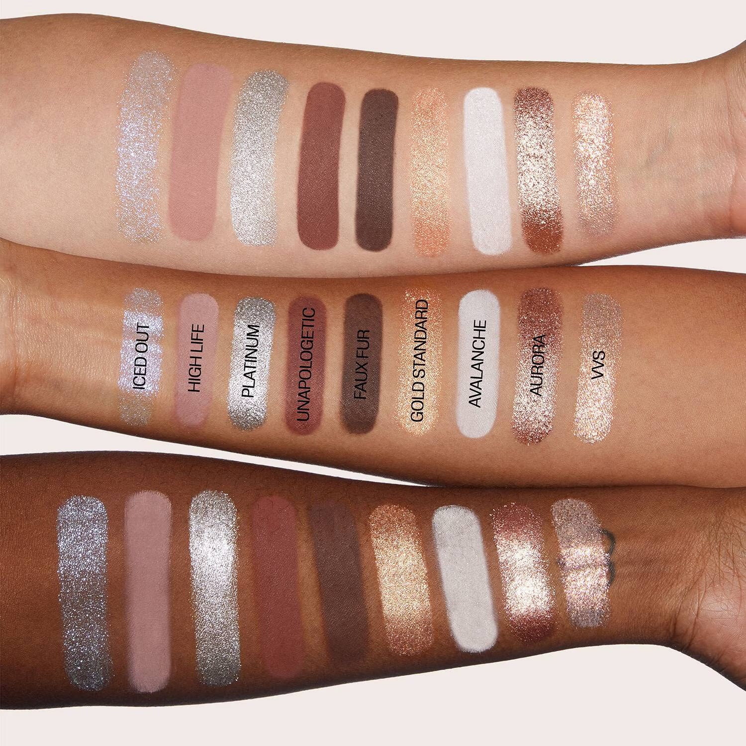 Makeup swatches on two arms with various shades and brand names.