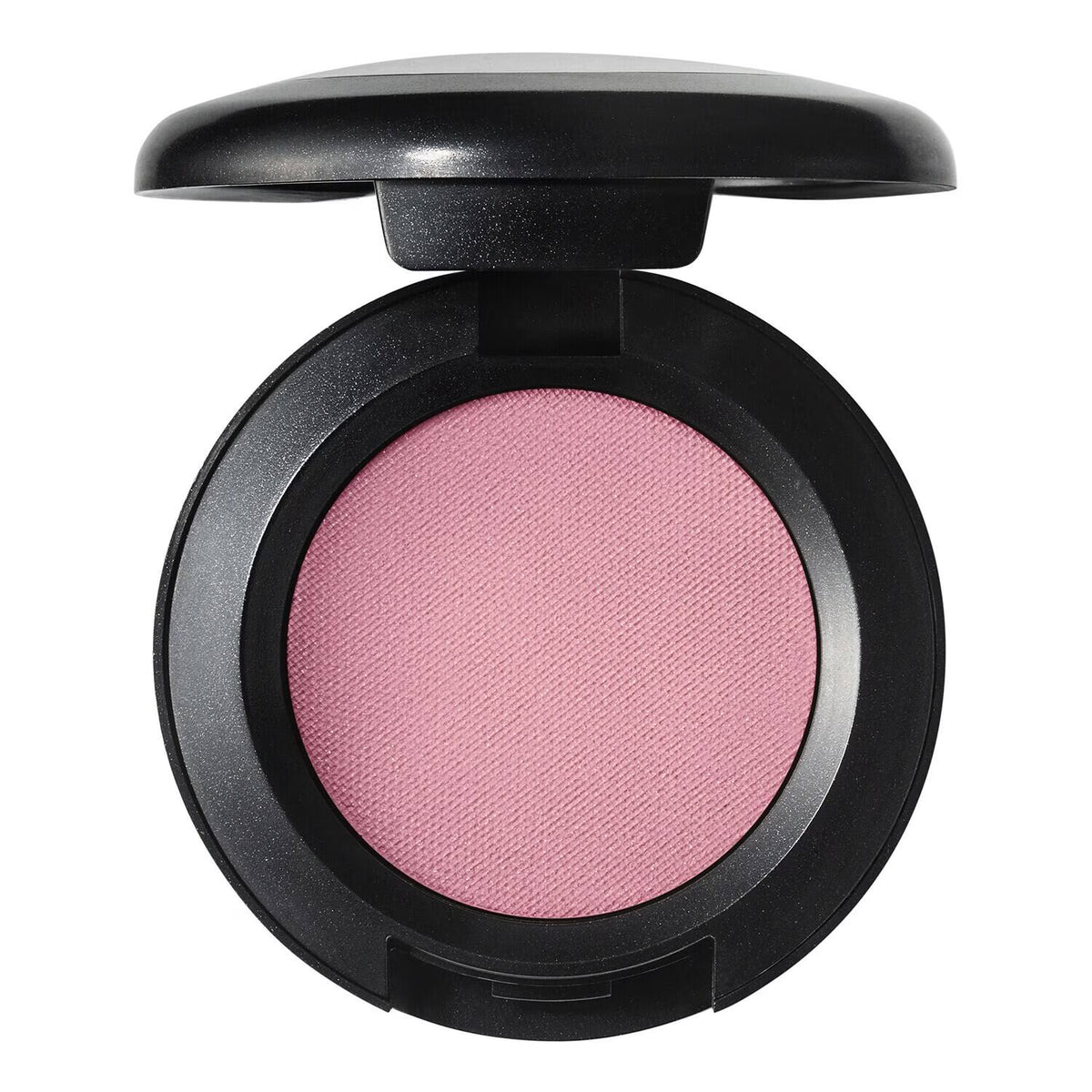An open round makeup compact showing a textured pink pressed powder, likely blush or eyeshadow, in a black compact against a plain white background.