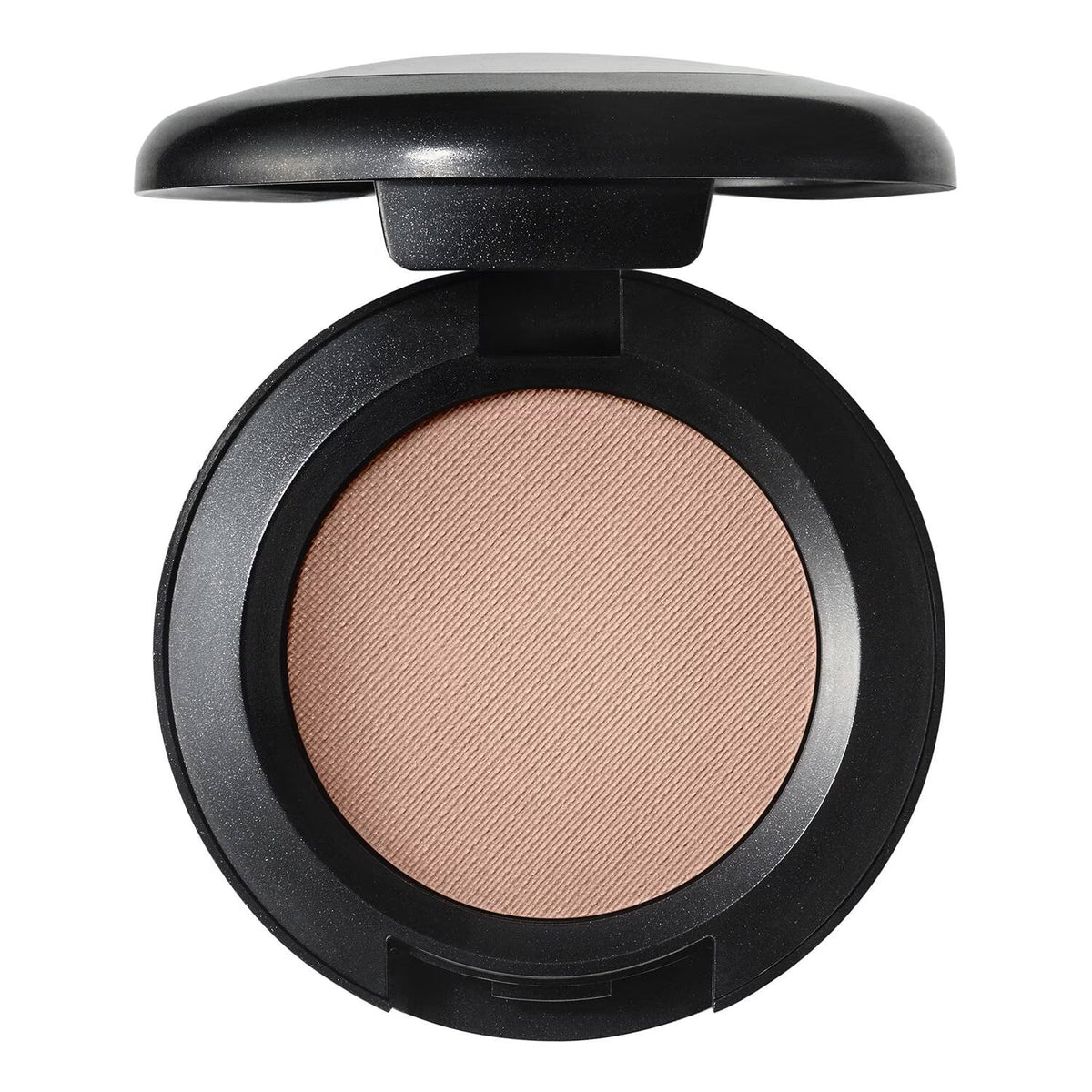 An open round makeup compact with a black casing and a textured, shimmering light beige pressed powder, shown against a plain white background.