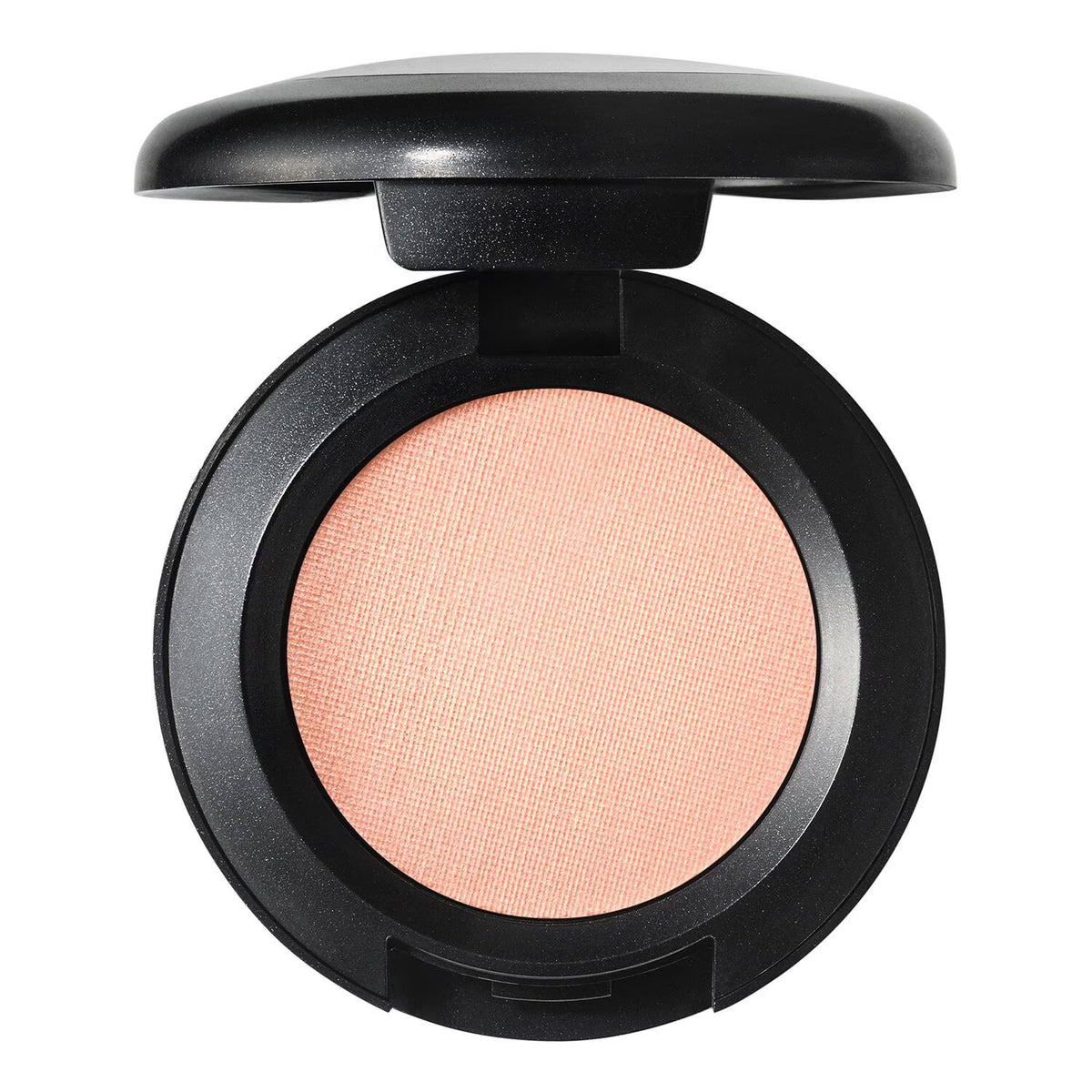 An open round makeup compact with a black casing and a textured peach-pink pressed powder pan, shown on a plain white background.