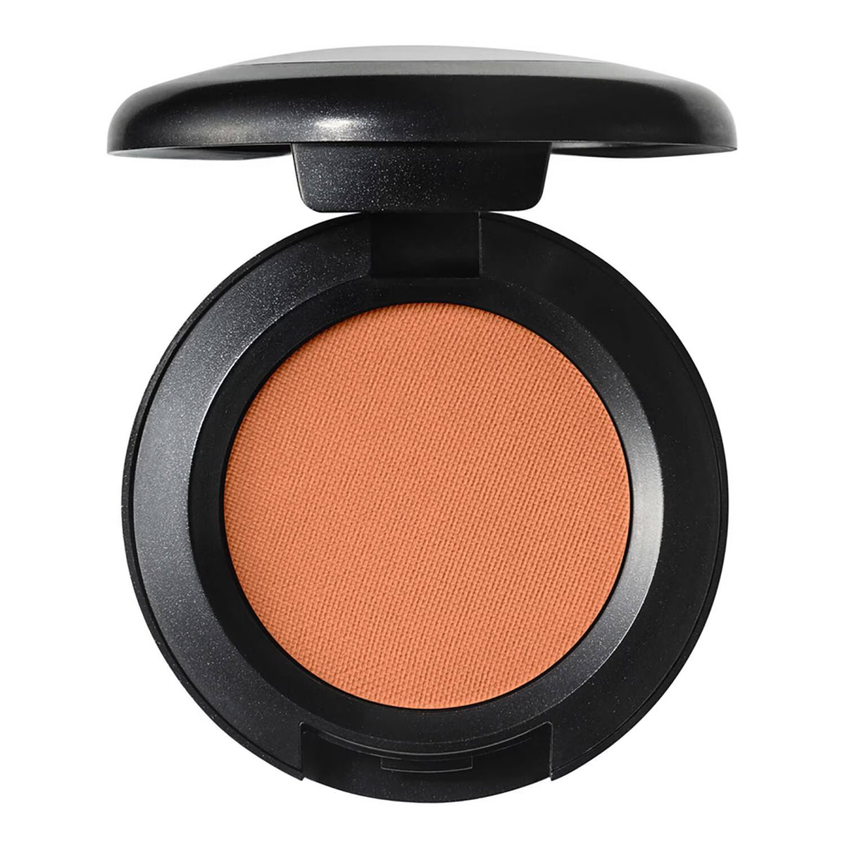 An open round makeup compact with a black casing and a textured warm peach-orange pressed powder pan, shown on a plain white background.