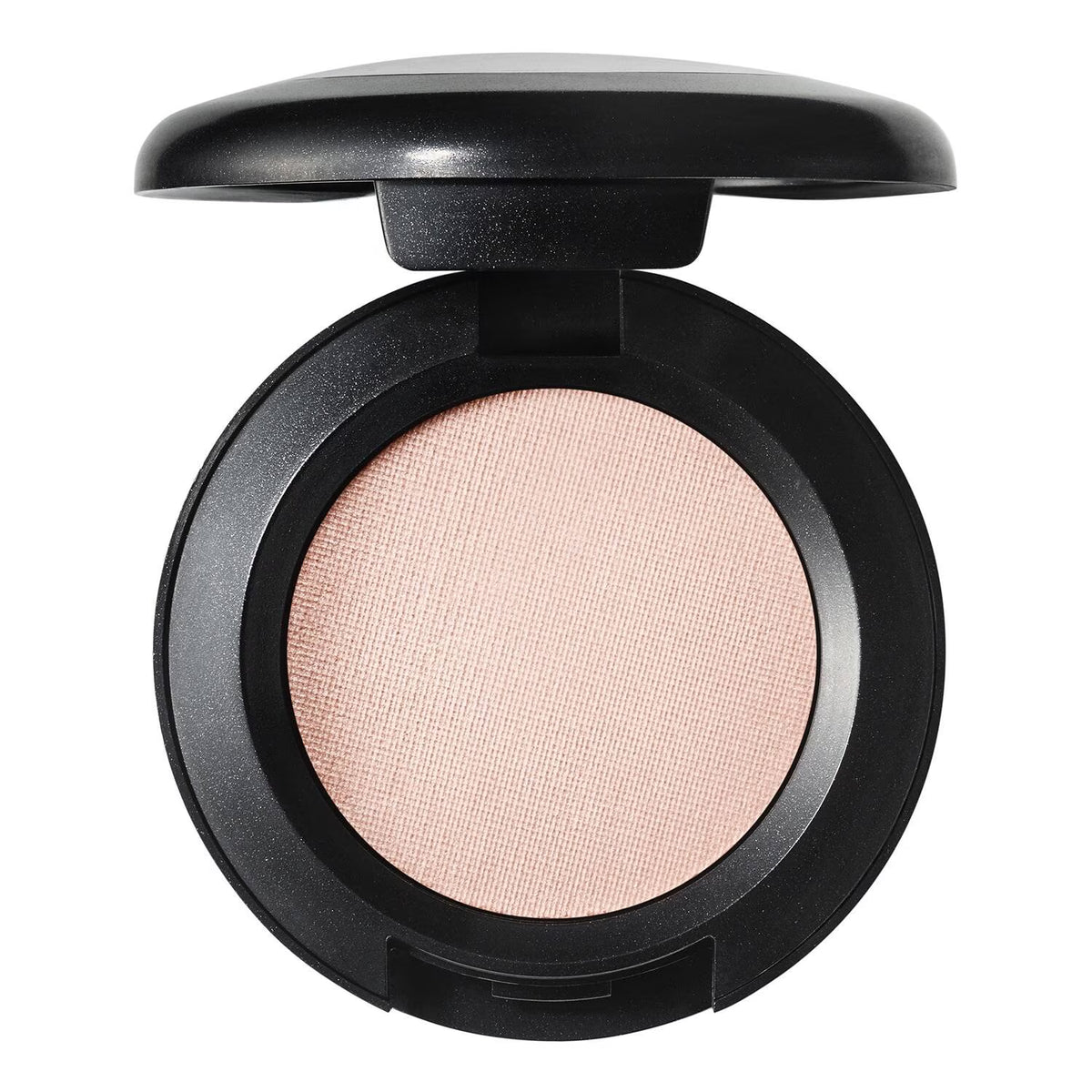 An open round makeup compact with a black casing and a light peach-pink pressed powder pan, shown on a plain white background.