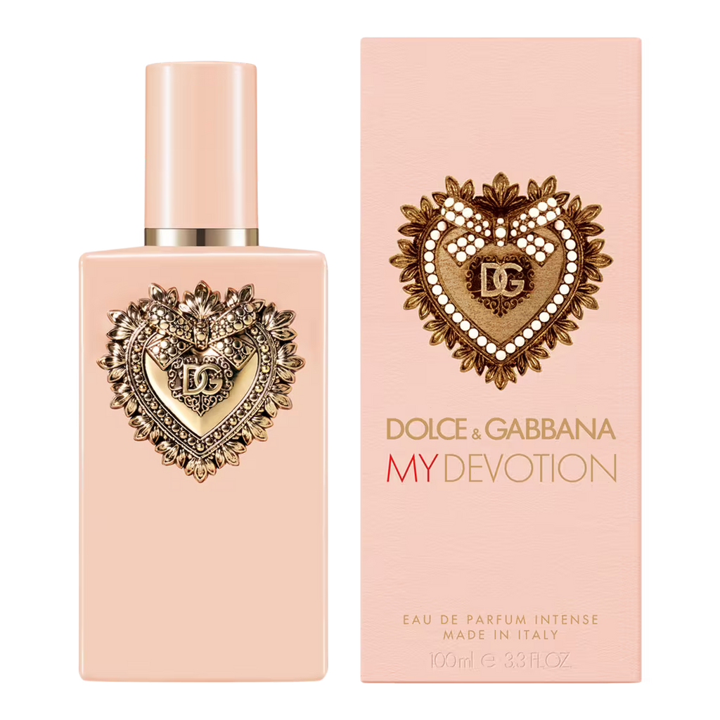 Dolce & Gabbana My Devotion Eau de Parfum 100ml bottle and its matching pink packaging box, both featuring a gold heart emblem with pearl accents on a pale pink background.