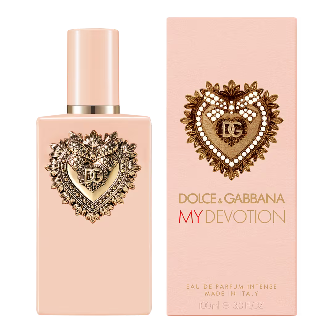 Dolce & Gabbana My Devotion Eau de Parfum 100ml bottle and its matching pink packaging box, both featuring a gold heart emblem with pearl accents on a pale pink background.