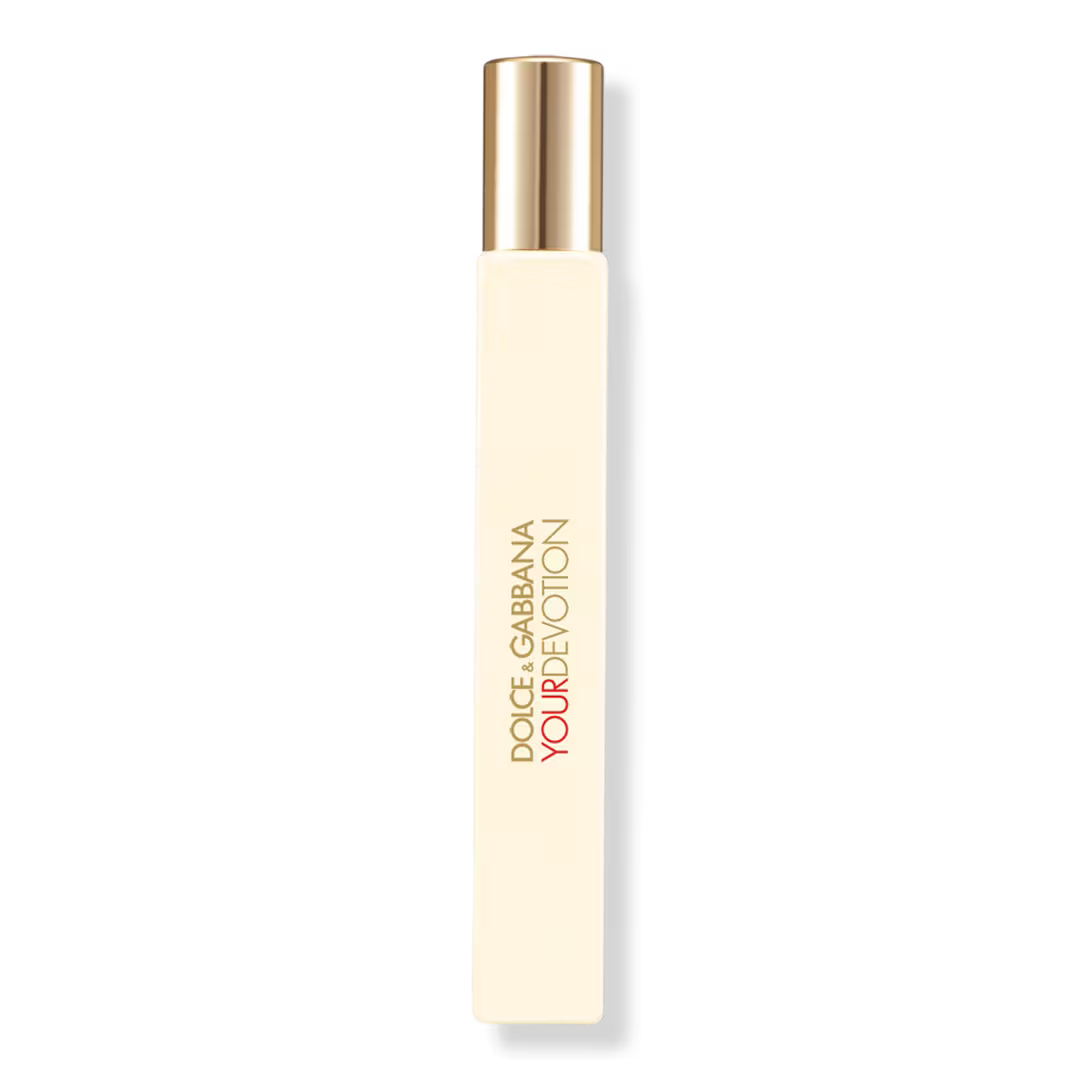 Dolce Gabbana Your Devotion perfume bottle with a cream-colored body and a metallic gold cap, shown on a plain white background.