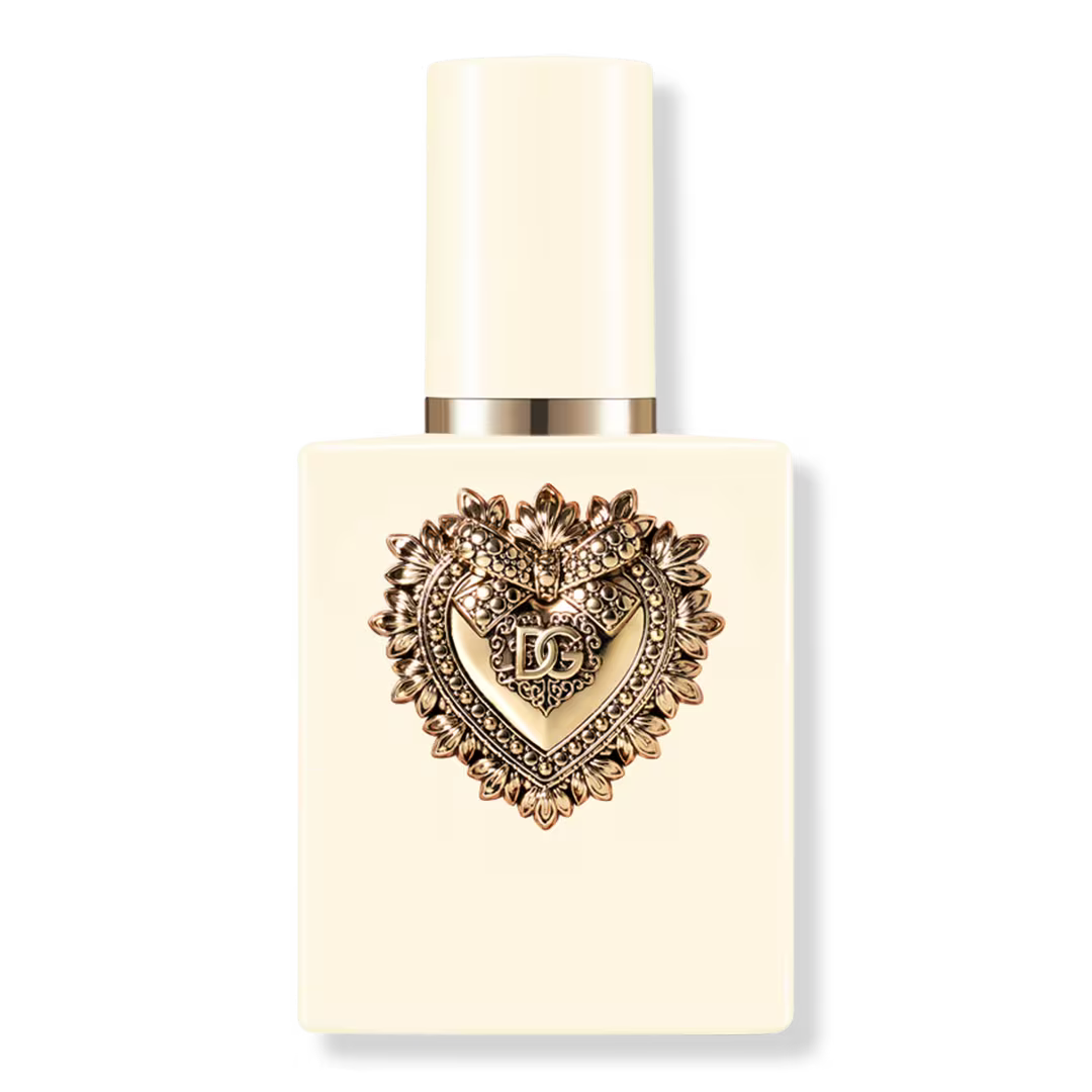 A cream-colored rectangular perfume bottle with a matching cylindrical cap, featuring a prominent gold heart-shaped heart emblem on the front with the letters 'HF' in the center, set against a plain white background.
