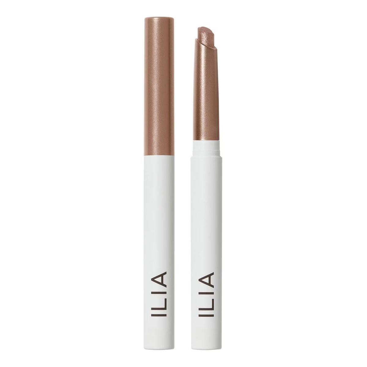Two ILIA cosmetic pencils shown upright on a white background, one closed and one open, both with white barrels, metallic rose-gold caps, and black ILIA branding.