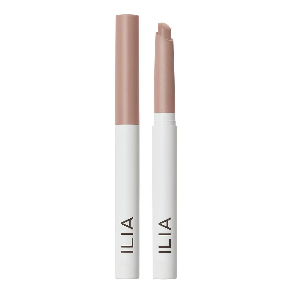Two ILIA lip color sticks in a nude pink shade, shown uncapped on a clean white background.