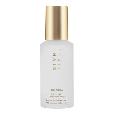 Fenty Hair The Mista hair and body fragrance mist in a frosted white bottle with a metallic gold cap, shown on a plain white background.