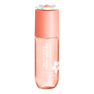 Marc Jacobs Daisy Mist Vanilla Gourmand perfume bottle, featuring a translucent peach-colored glass body and a coral-pink cap with a white flower accent, on a solid white background.