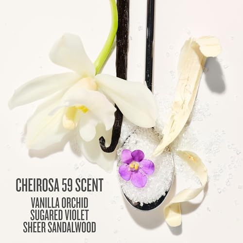 A Sol de Janeiro travel set in a clear zippered case, featuring a purple shower oil bottle, a body butter jar, and a travel-sized shower spray, on a white background.
