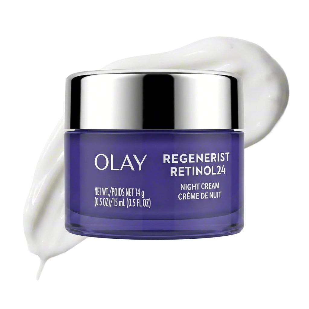 Olay Regenerist Retinol 24 Night Cream in a dark purple jar with a reflective silver lid, shown with a swirl of white cream on a white background.