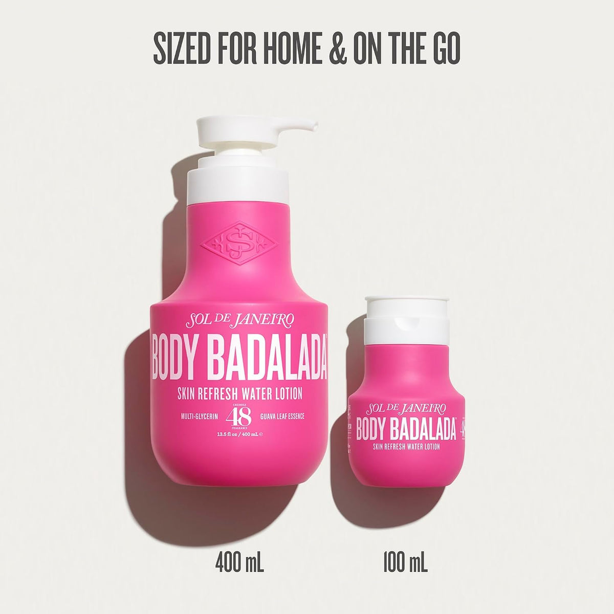 Two pink bottles of 'Body Badalada' lotion on a white background with text indicating size.