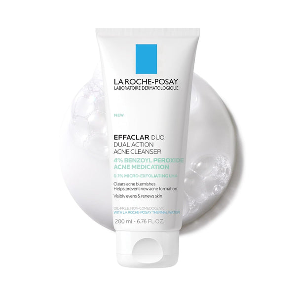 A 200 ml tube of La Roche-Posay Effaclara Duo Dual Action Acne Cleanser, featuring a white tube with a blue and green label, set against a white background with a circular graphic of clear bubbles.