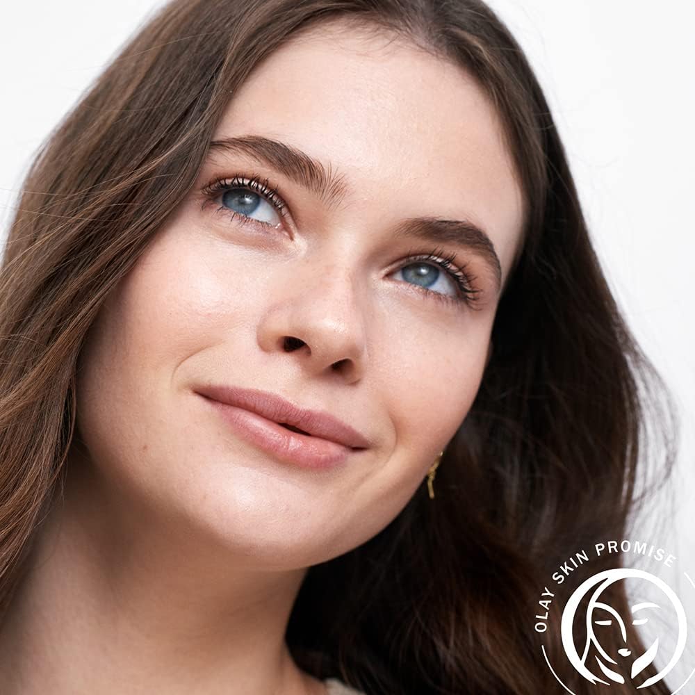 Close-up of a woman's face with Olay Skin Promise logo in the corner
