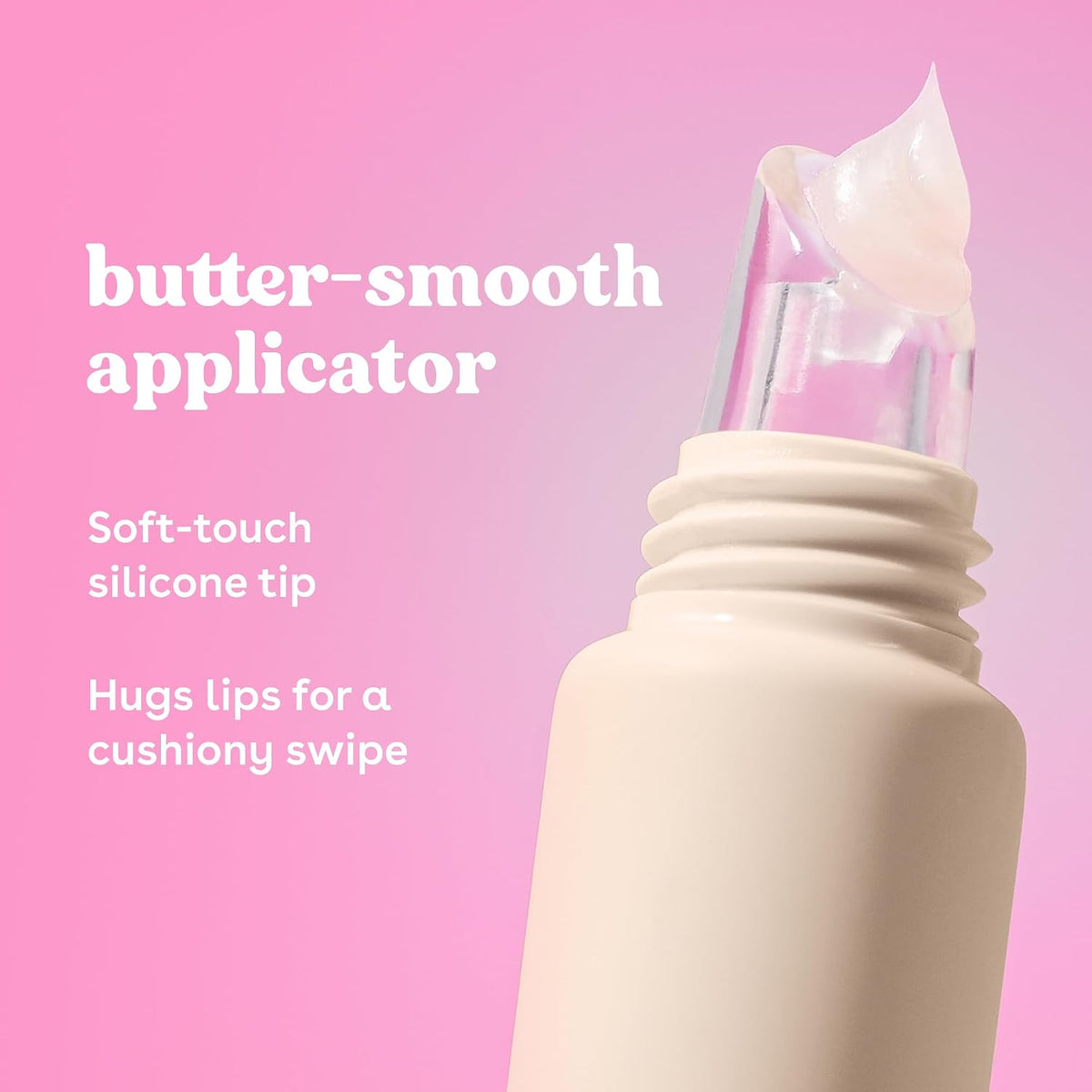 Cream-colored cosmetic tube with a clear silicone applicator tip holding a dollop of product, set against a pink background with white descriptive text.