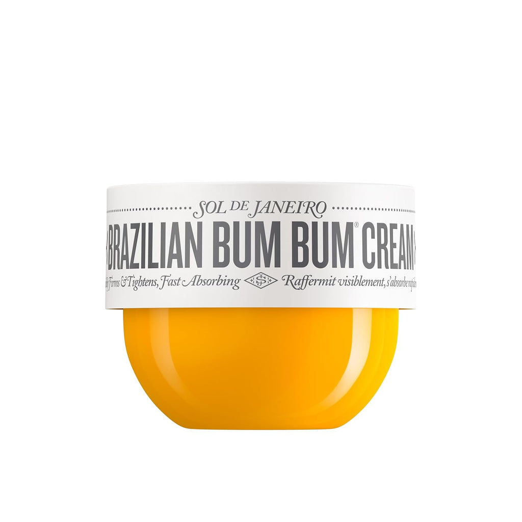 A jar of SOL DE JANEIRO Brazilian Bum Bum Cream with a white label and a vibrant yellow-orange cream visible inside, set against a plain white background.