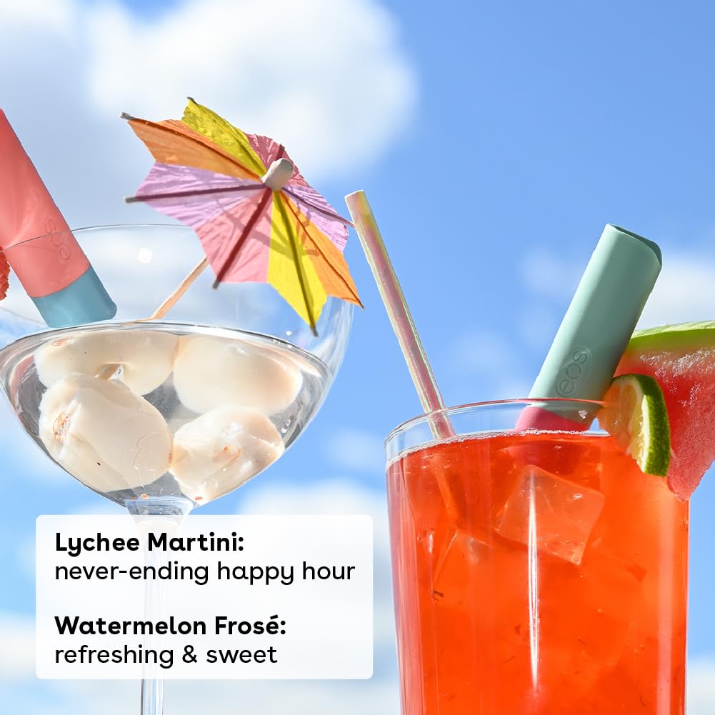 Two cocktails, a lychee martini and a watermelon frosé, with colorful umbrellas and straws against a blue sky.