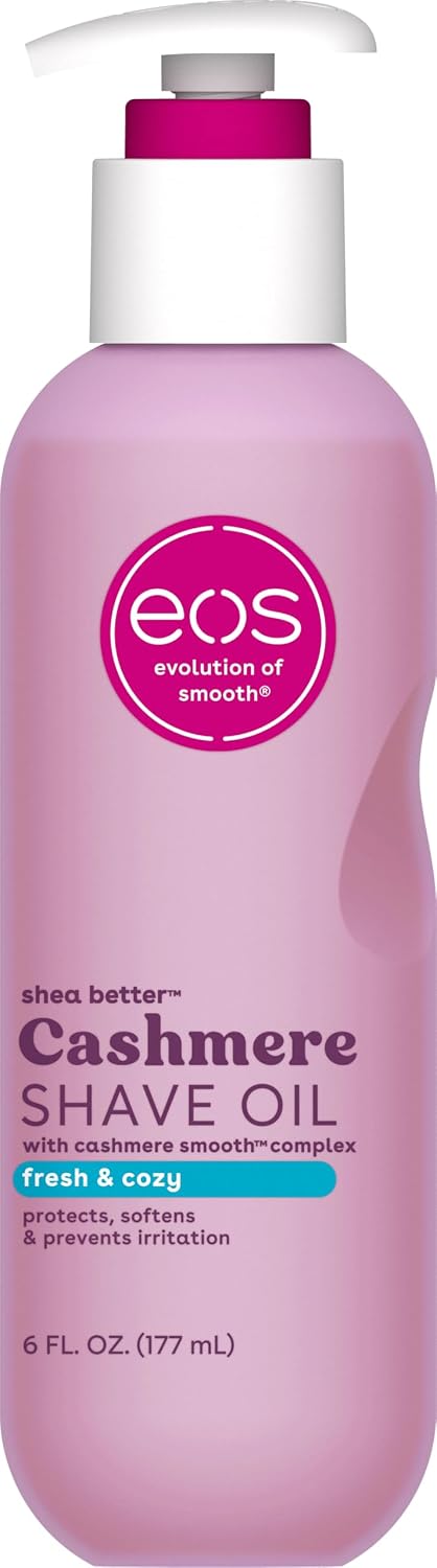 A bottle of EOS Cashmere Shave Oil in a light pink bottle with a white pump and a magenta cap, on a white background.