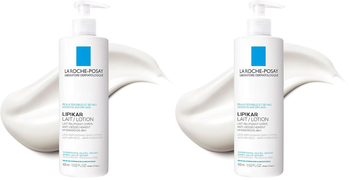 Two white bottles of La Roche-Posay Lipikar Lait Actif lotion shown side by side, each with a white cream swirl behind it on a white background.