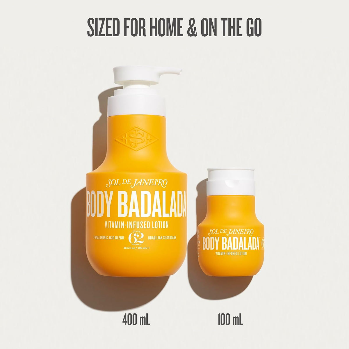 Two bottles of Sol de Janeiro Body Badalada lotion, one large and one small, on a light gray background.