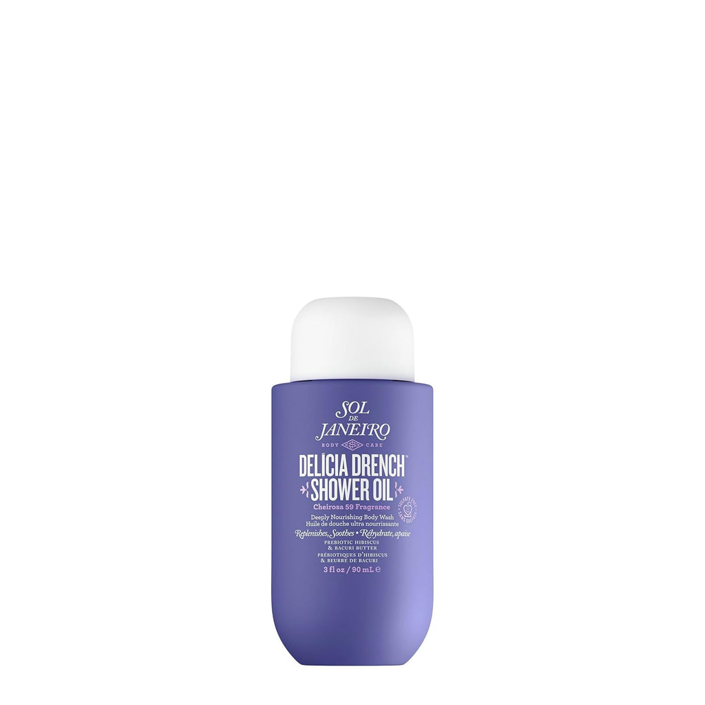 A bottle of Sol Janeiro Delicia Drench Shower Oil in a lavender purple bottle with a white cap, centered on a solid white background.