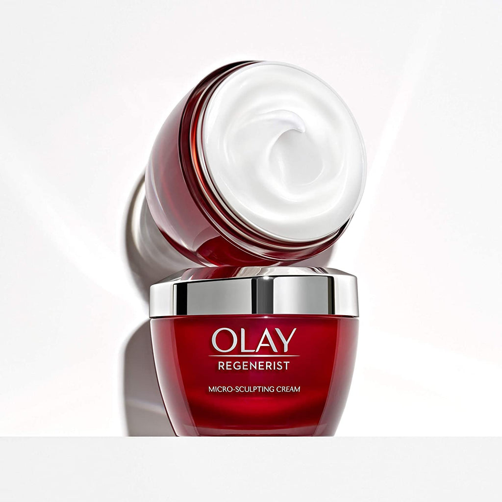 Olay Regenerist skincare cream jar with a white lid on a light gray background