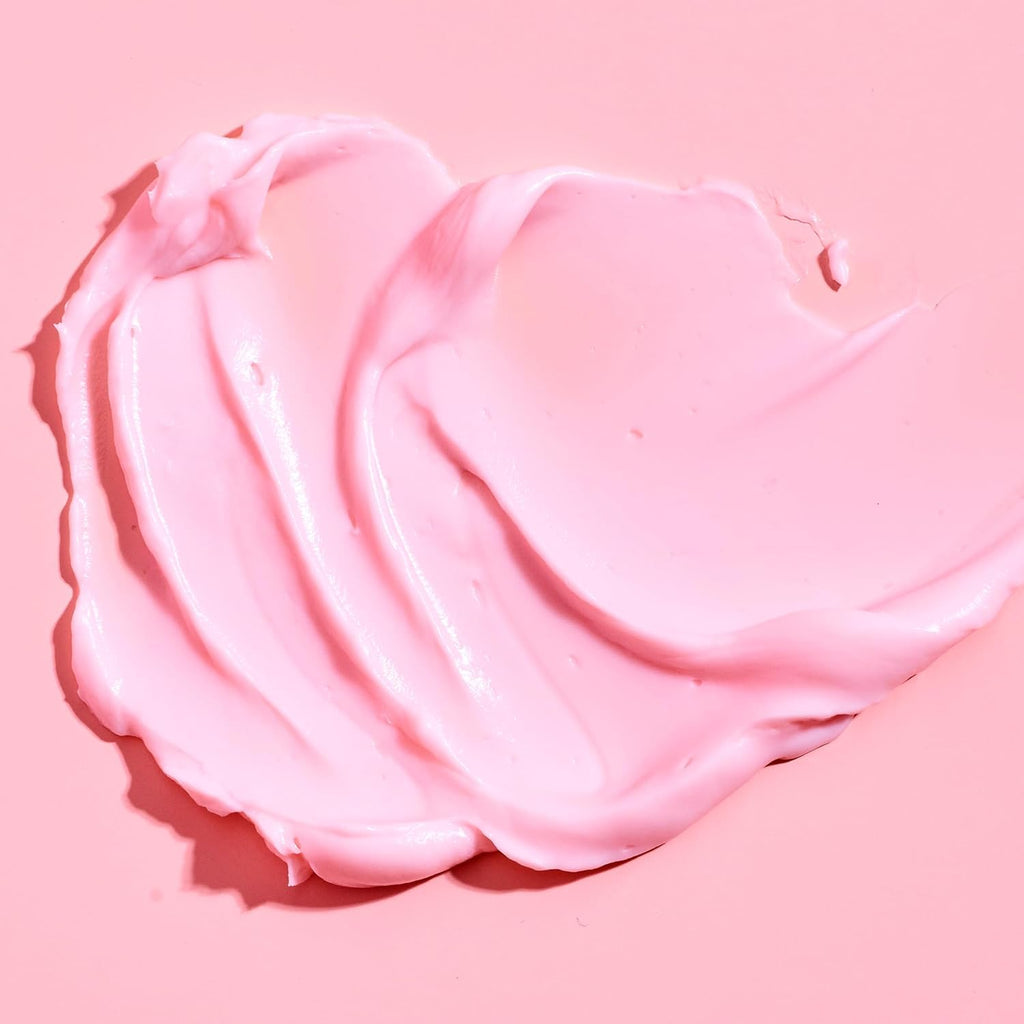 Pink whipped cream on a pink background