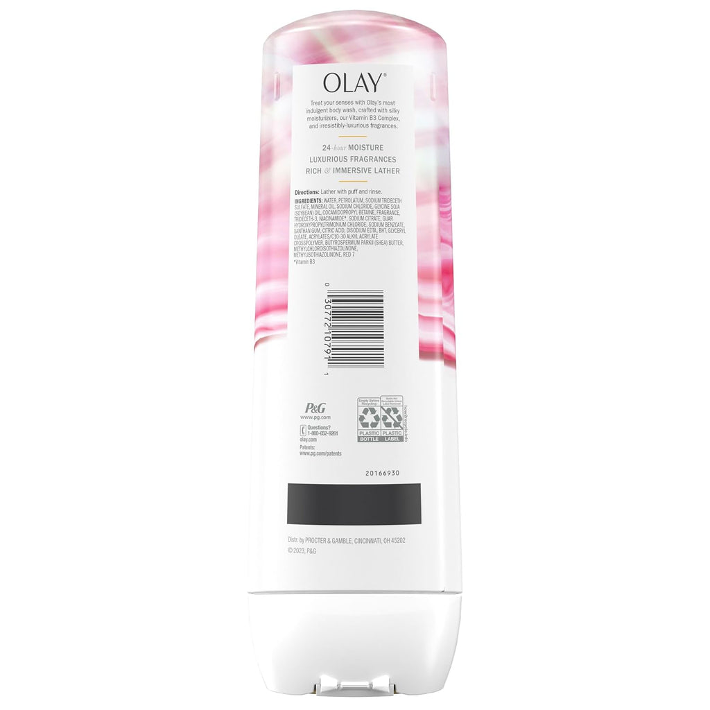 Olay lotion bottle with floral design on a white background
