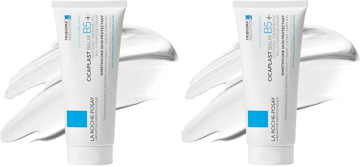 Two bottles of La Roche-Posay Cicaplast Baume B5+ with white gloves on a white background