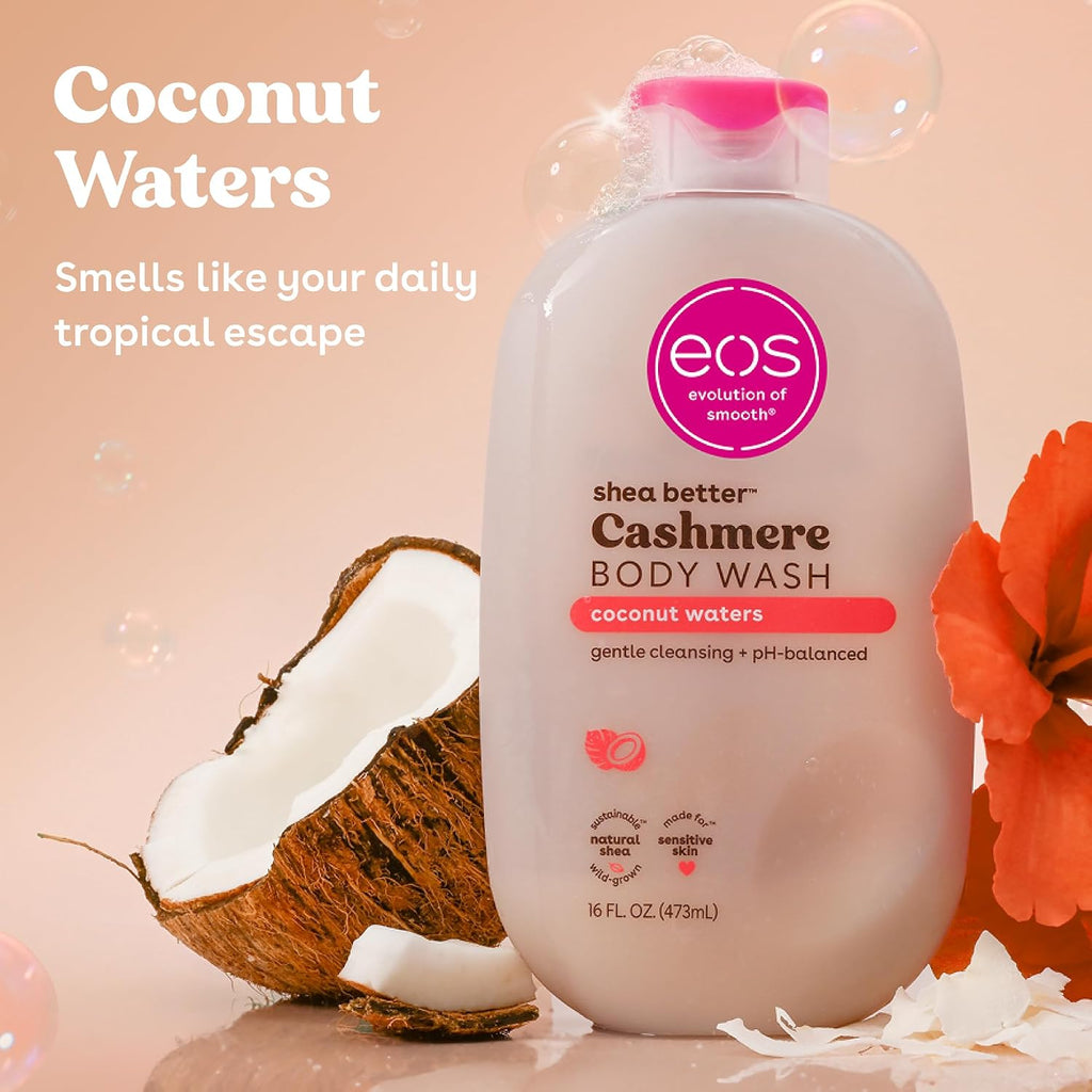 eos shea butter cashmere body wash bottle with coconut and flower on a pink background