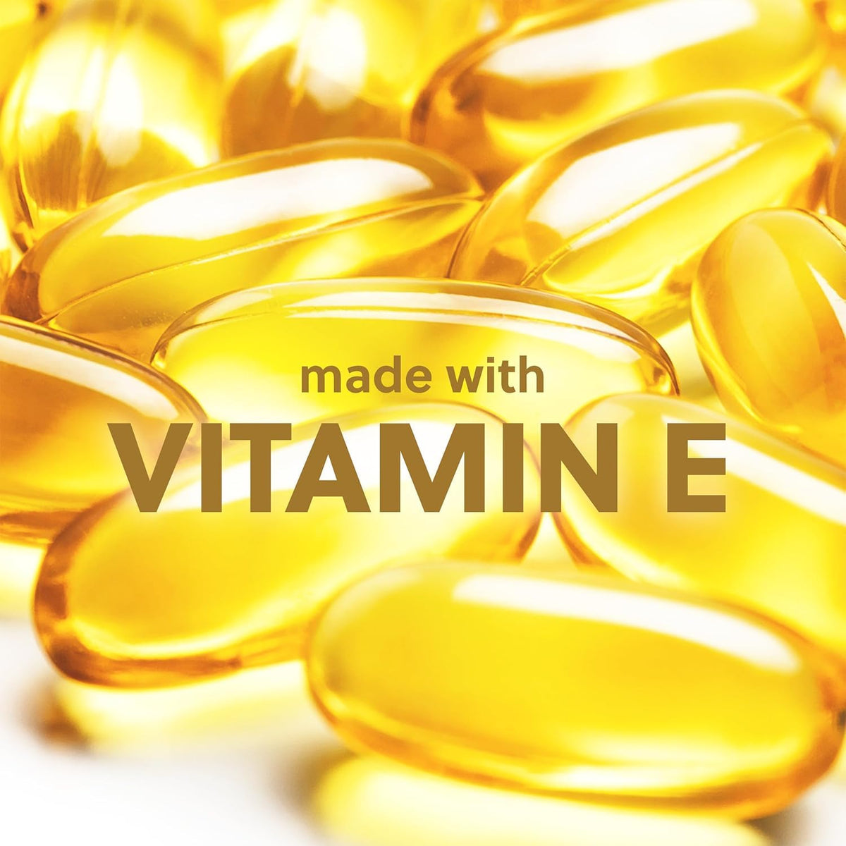 Yellow vitamin E capsules with 'made with Vitamin E' text on a white background