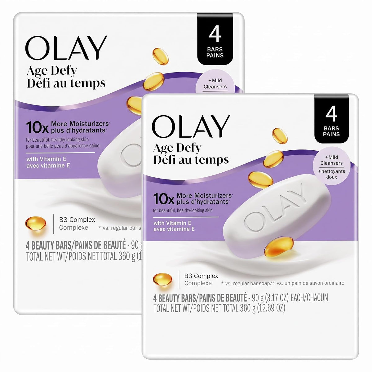 Two Olay Age Defy moisturizer soap bar boxes shown on a plain white background, with one box in front and one behind. The packaging is white with purple and lavender graphics, black text, and small gold oval highlights.
