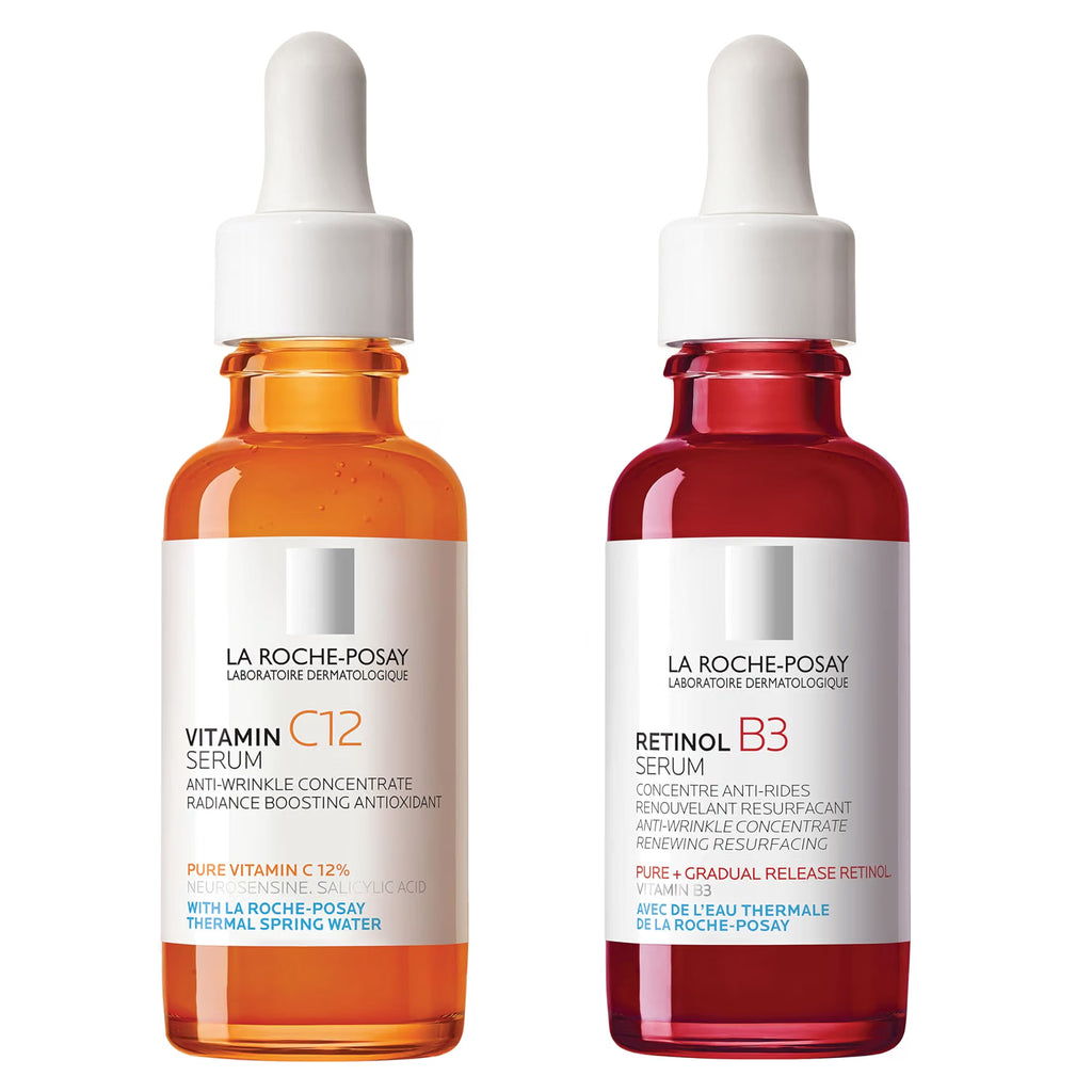 Two La Roche-Posay skincare serum bottles, one orange and one red, on a white background.