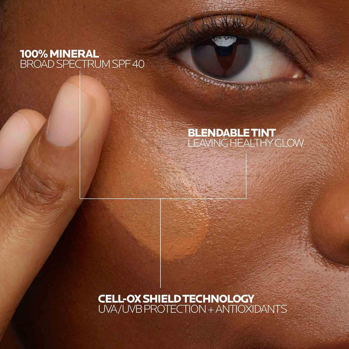 Close-up of a person's eye with skin texture, showing product features like SPF 40 and blendable tint.