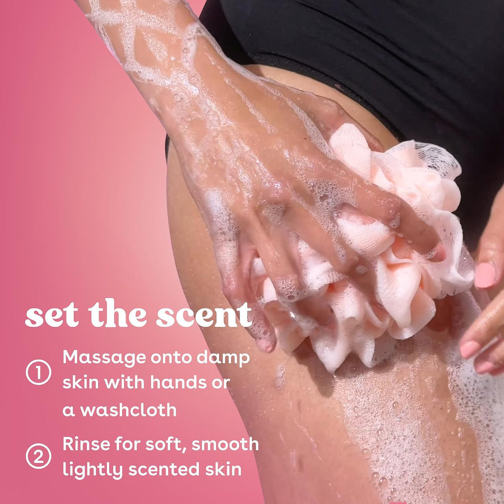 Person applying soap to their skin with a pink gradient background