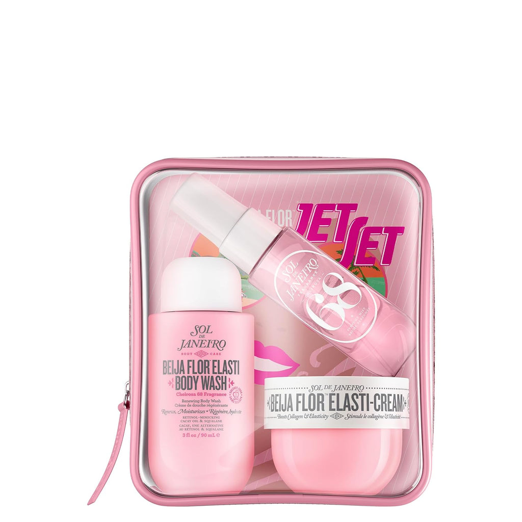 Pink travel set with body wash and cream in a clear case on a white background