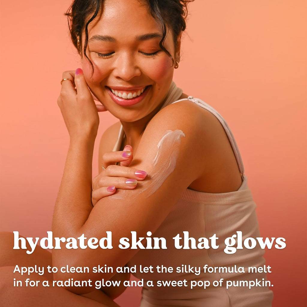 A woman with a radiant smile applies a white cream product to her shoulder and cheek against a warm peach background. White text at the bottom reads, 'hydrated skin that glows' with additional product application instructions below.