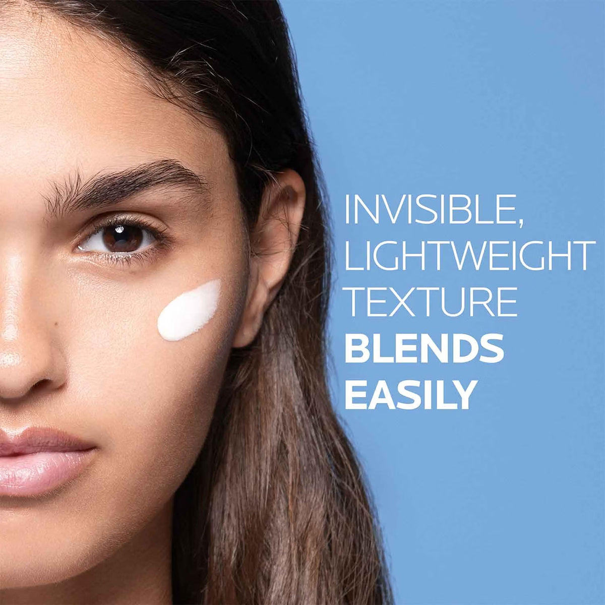 Woman's face with a small white patch on her cheek against a blue background, text 'Invisible, Lightweight Texture Blends Easily'.