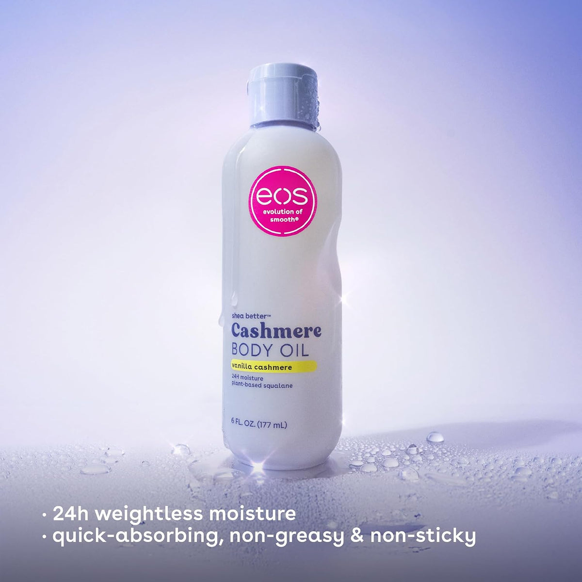 Bottle of eos Cashmere Body Oil on a light purple background