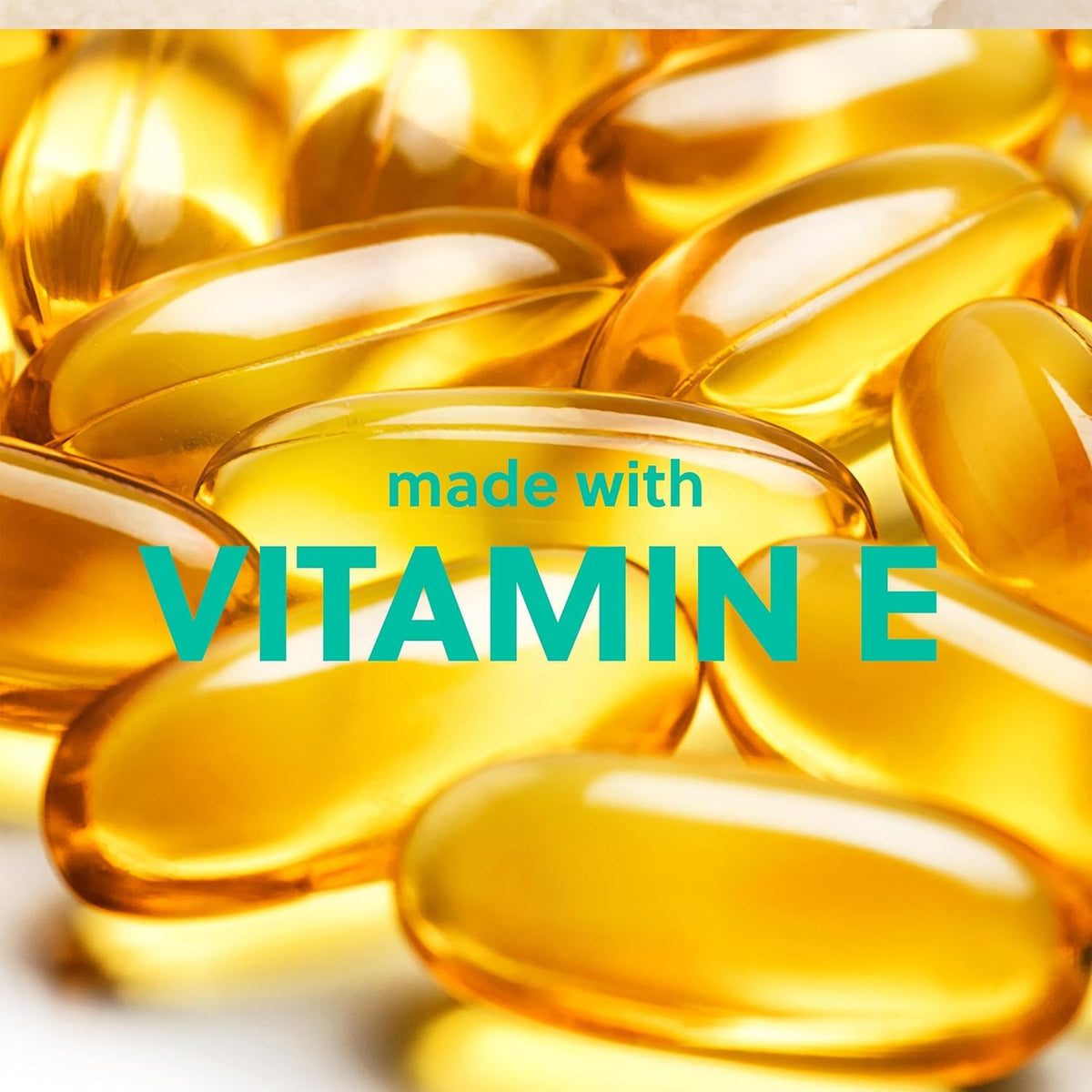 Yellow vitamin E capsules with 'made with VITAMIN E' text on a light background
