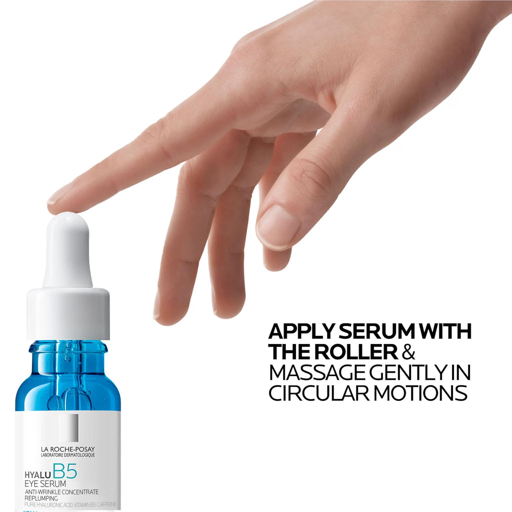 La Roche-Posay HyaluB5 Eye Serum in a blue glass dropper bottle, shown next to a human hand demonstrating the application technique with the included roller, on a white background with instructional text.