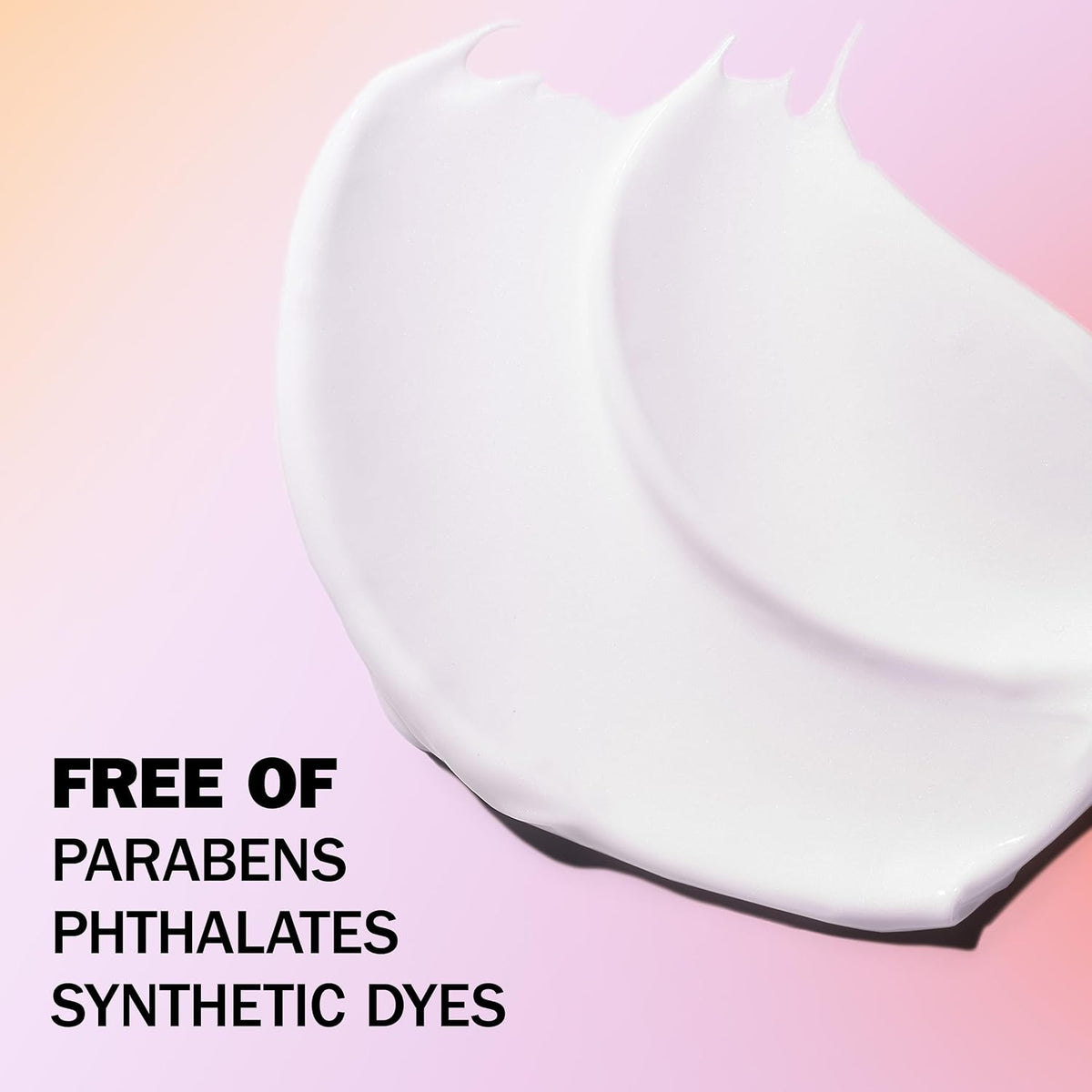 White product on a pink background with text indicating it is free of parabens, phthalates, and synthetic dyes.