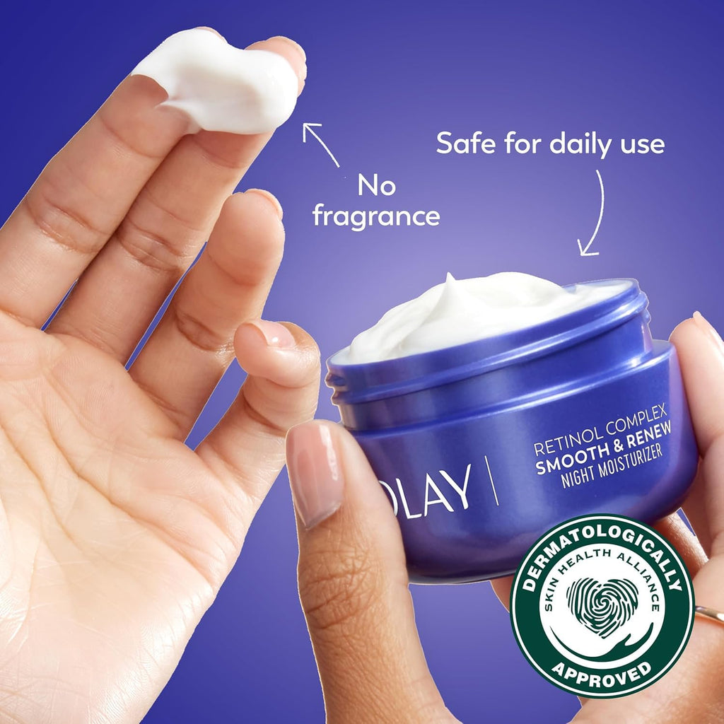 Olay moisturizer jar with cream on fingers and branding elements on a blue background