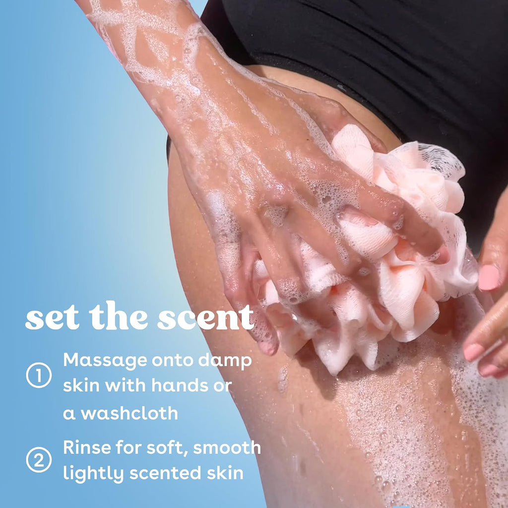 Person applying soap to their skin with a blue background