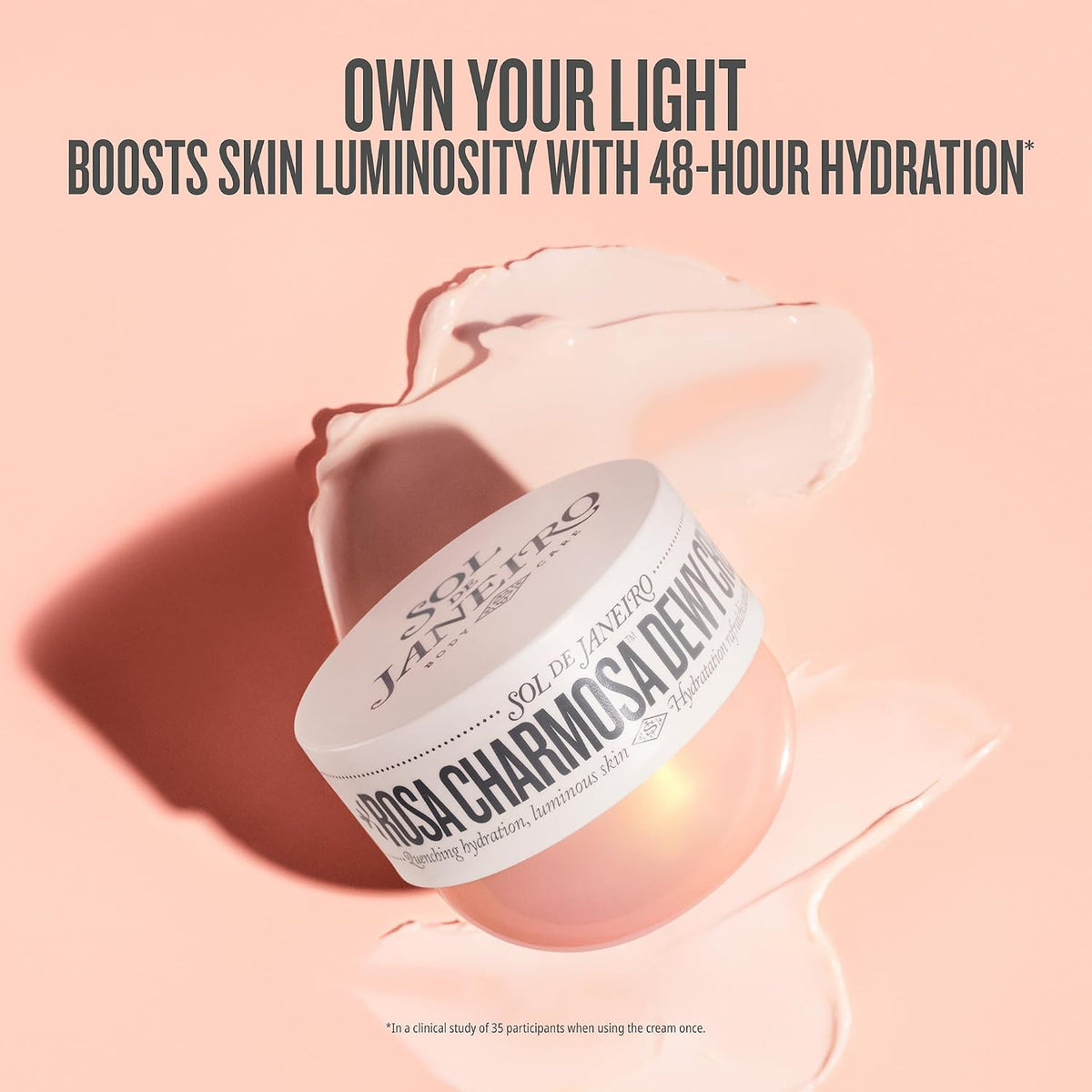 Cosmetic jar with 'Rosa Charmosa Dew' on a pink background, featuring text about skin hydration.