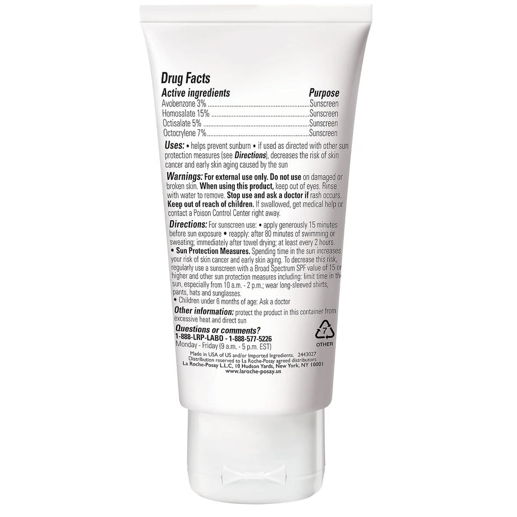 The back of a white sunscreen tube showing detailed 'Drug Facts' text, including active ingredients like avobenzone, homosalute, octinoxate, and oxybenzone, along with usage directions and manufacturer contact info.