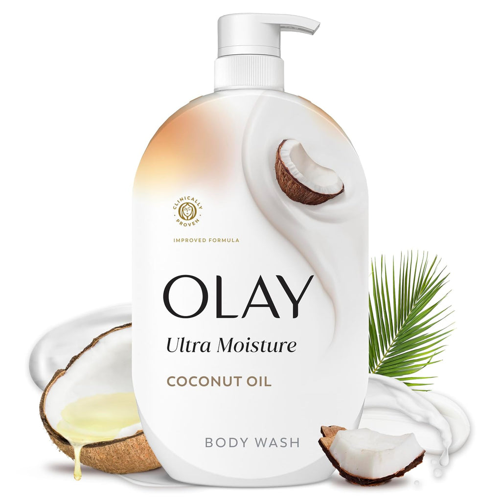 OLAY Ultra Moisture Coconut Oil body wash bottle with coconut pieces and a palm leaf on a white background