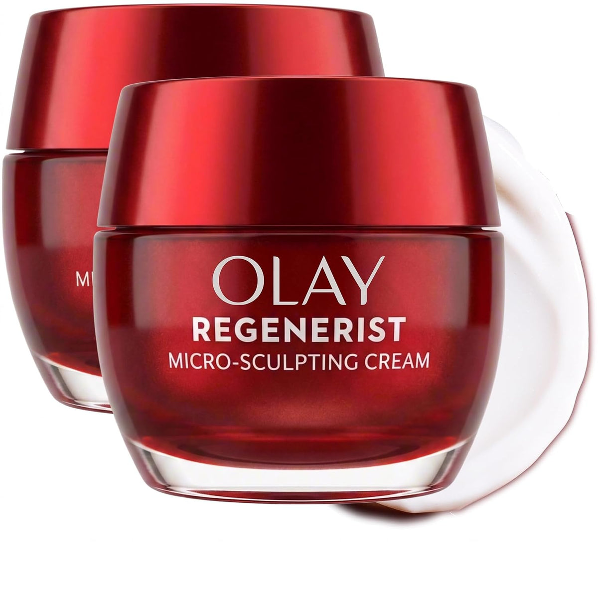 Two Olay Regenerist Micro-Sculpting Cream jars in a glossy deep red color, with a white cream smear on a clean white background.