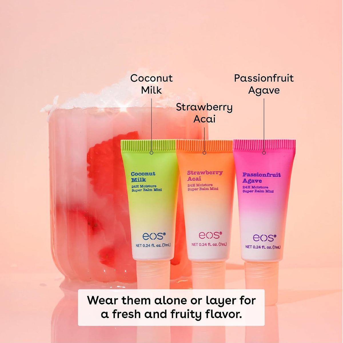 Three EOS skincare moisturizer tubes labeled Coconut Milk, Strawberry Acai, and Passionfruit Agave, displayed in front of a pink drink with fruit pieces and overlaid flavor labels.